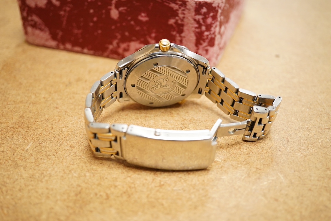 A gentleman's mid 1980's stainless steel and gold plated Omega Seamaster Professional Chronometer automatic wrist watch, with blue dial, dot numerals and date aperture, movement c.1109, case diameter 40mm, on an Omega st